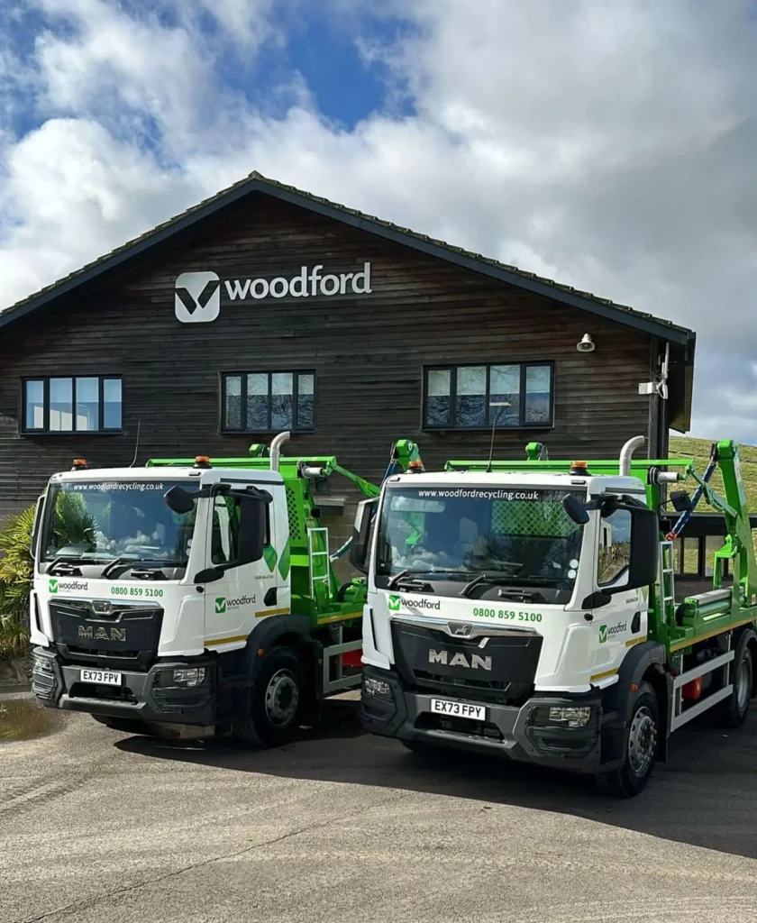 exterior of woodford recycling with two trucks | Woodford Recycling