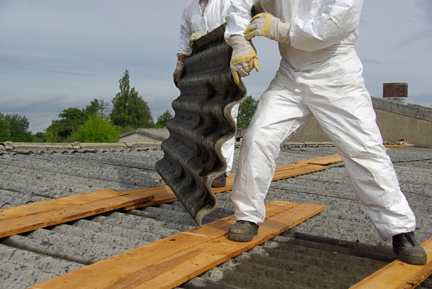 Workers wearing PPE removing asbestos - Woodford Recycling